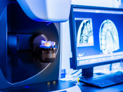 Dental crown being created in milling machine