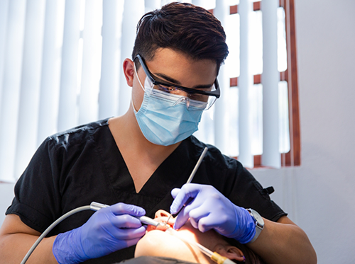 Dentist using The Wand to treat patient