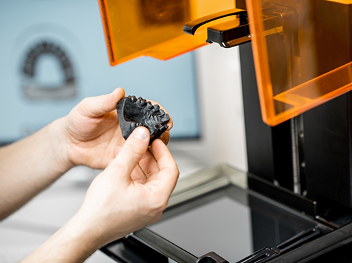 Picking up model of teeth from 3D printer