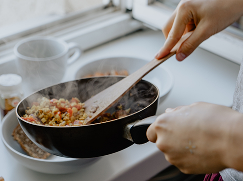 Cooking a meal in a pan